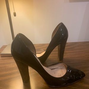 Reed Krakoff black patent leather stacked heels.
